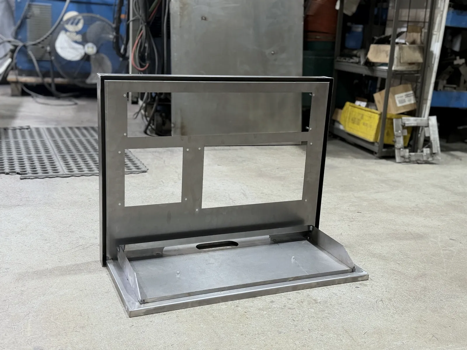 Compact camera display holder from the front, showing the base cable slot