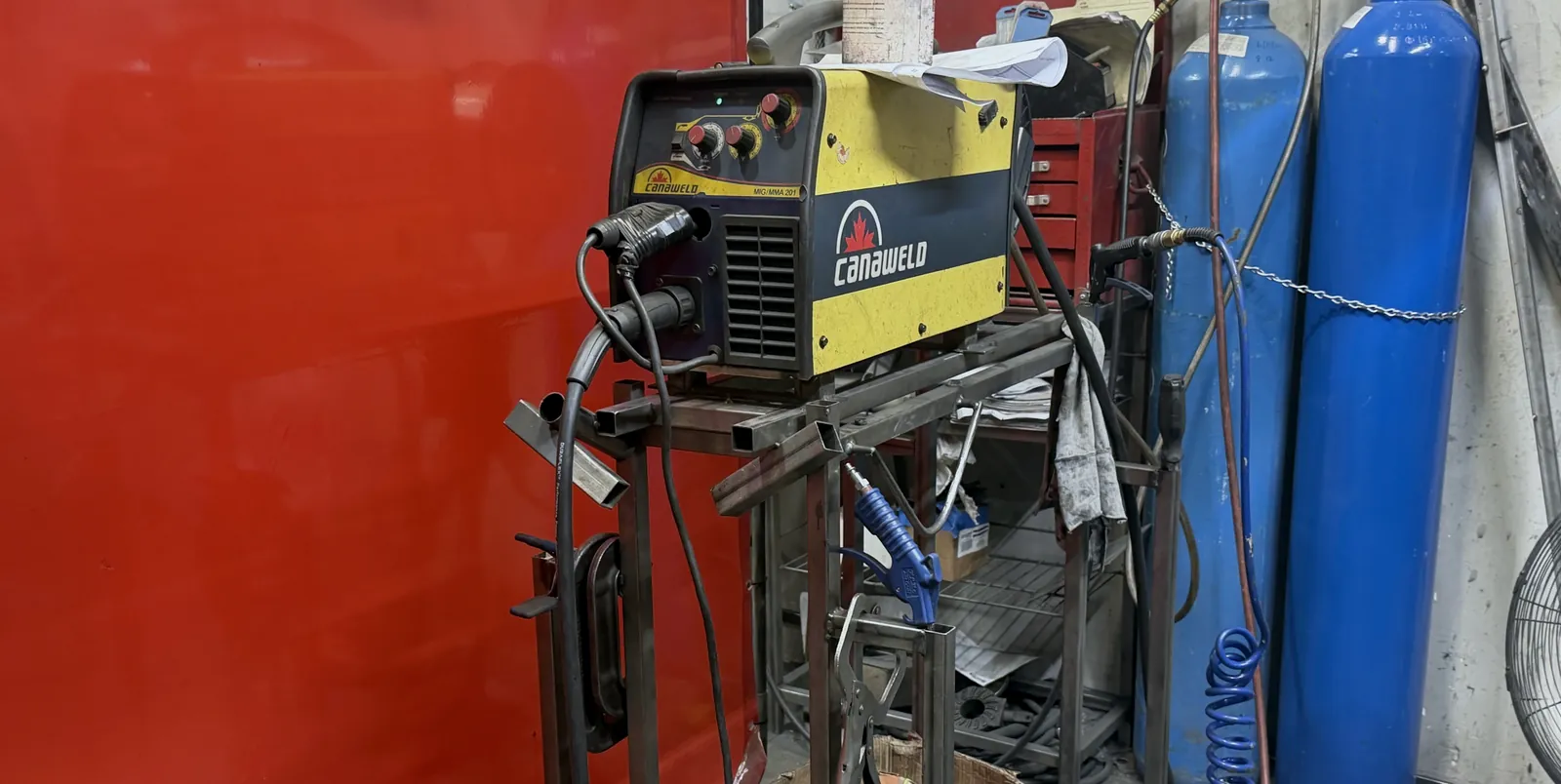 MIG welding station with shielding gas cylinders at Aeco Displays