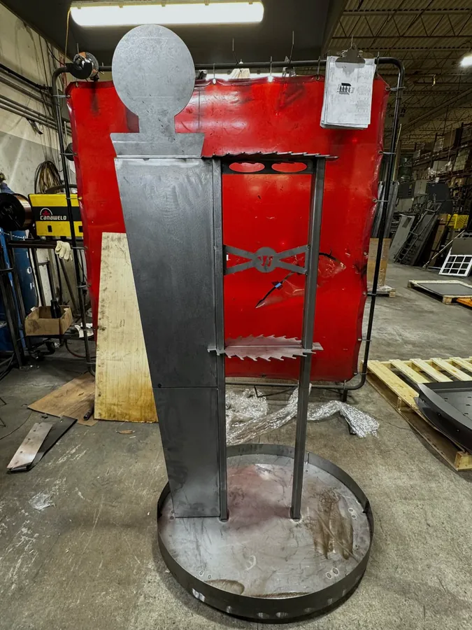Custom themed cutout display stand on round base